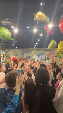 Families enjoy indoor entertainment activities in Tri Protoka venue