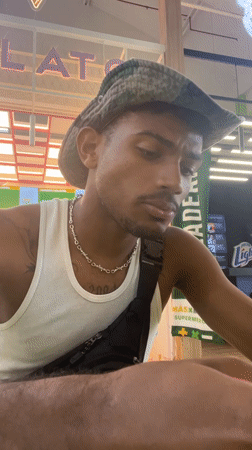 Man dines at food court in Porlamar, Venezuela