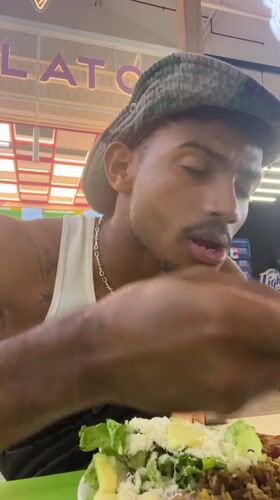 Man dines at food court in Porlamar, Venezuela