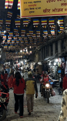 Evening street life and temple activity documented in Kathmandu