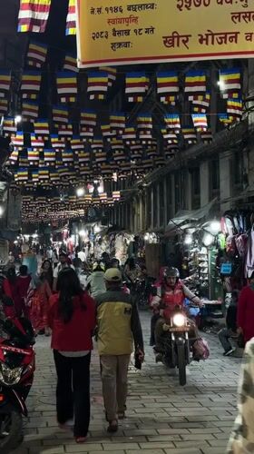 Evening street life and temple activity documented in Kathmandu