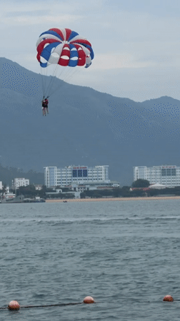 Early morning parasailing activity observed above Nha Trang waters