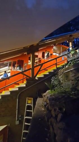 Evening visit to century-old Santiago funicular captures passengers, fountains