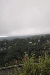 Foggy morning landscape captured from elevated viewpoint in Rendang