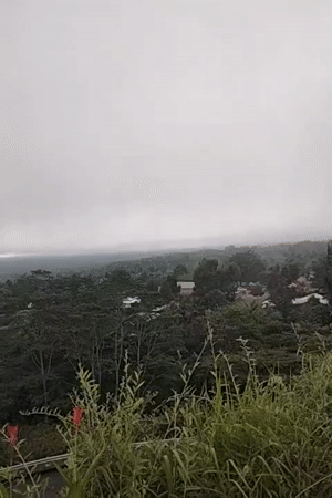 Foggy morning landscape captured from elevated viewpoint in Rendang