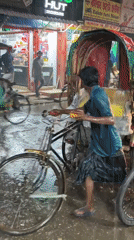 Rickshaw puller works through flood waters in Dhaka rain