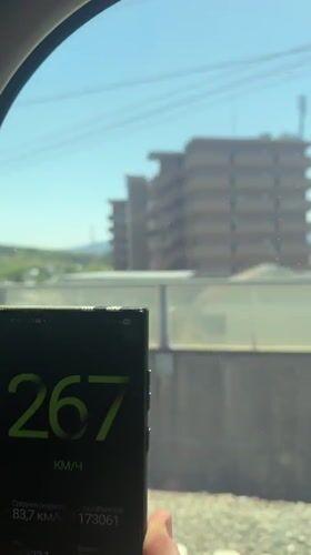 Train passenger records speedometer app showing increasing velocity in Japan