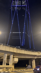Exchange 106 skyscraper displays colorful geometric light patterns in Kuala Lumpur