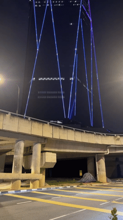 Exchange 106 skyscraper displays colorful geometric light patterns in Kuala Lumpur