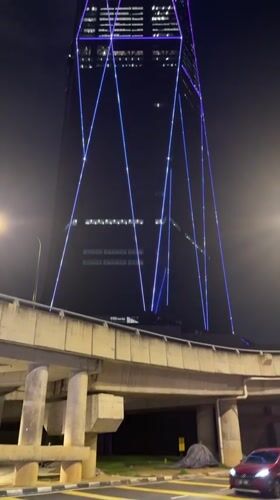 Exchange 106 skyscraper displays colorful geometric light patterns in Kuala Lumpur