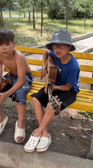 Guitar and singing on a park bench in Krasnoturansk
