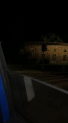 Nighttime street video captured from moving car in Milan