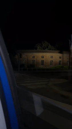Nighttime street video captured from moving car in Milan