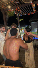 Young adults celebrate with shots at Playa del Carmen bar