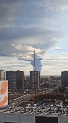 Urban landscape observed under dramatic contrasting skies from elevated perspective