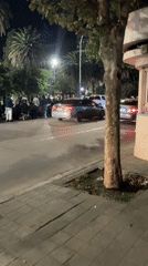 Nighttime religious procession carries shrouded figure through Bahía Blanca streets