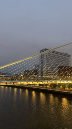 Zubizuri Bridge at dusk, Bilbao waterfront