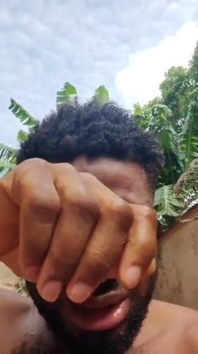 Man seen crying near child in Obosi, Nigeria