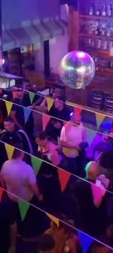 Morning social gathering captured at Arica nightclub venue