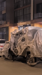Tarp-covered vehicle spotted with weathered covering in Moscow