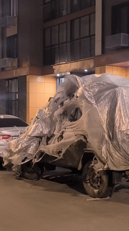 Tarp-covered vehicle spotted with weathered covering in Moscow