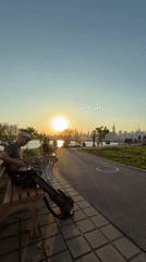 Sunset guitar performance and blooming flowers captured in NYC park