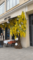 Moscow cafe district bustles with shoppers, dining, flower vendors