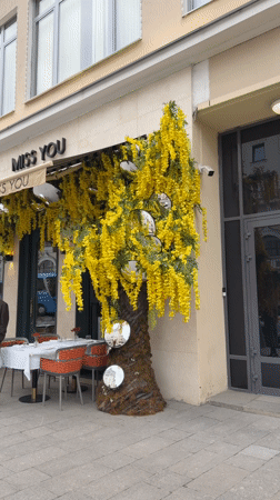 Moscow cafe district bustles with shoppers, dining, flower vendors