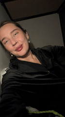 Woman takes morning selfies indoors in Moscow