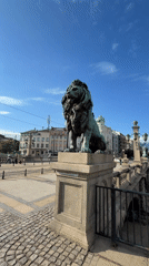 Tourist documents Sofia's Eagles' Bridge lions and city trams