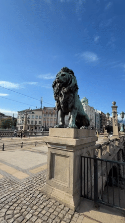 Tourist documents Sofia's Eagles' Bridge lions and city trams