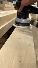 Workers construct wooden frameworks in Luxembourg warehouse facility