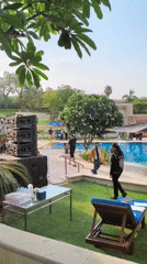 Poolside event with cat sculpture documented at New Delhi resort
