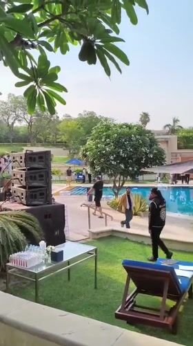 Poolside event with cat sculpture documented at New Delhi resort