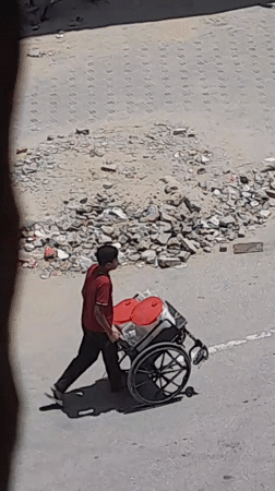 Daily movement and supply activity across a crowded tent settlement