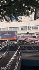 Street life and political banners mix in central Tehran