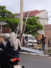 Metal structure collapses against utility pole in Lhokseumawe, Indonesia