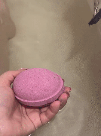 Pink bath bomb used in Noviy, Russia bathtub
