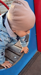 Toddler plays at Izhevsk playground during afternoon outing
