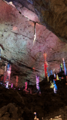Tourist explores illuminated caves and cultural sites in Jundiping