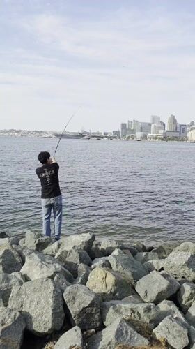 Two anglers fish from rocky Coronado shoreline
