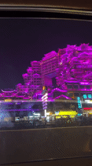 Night filming of illuminated traditional Chinese building in Zhangjiajie