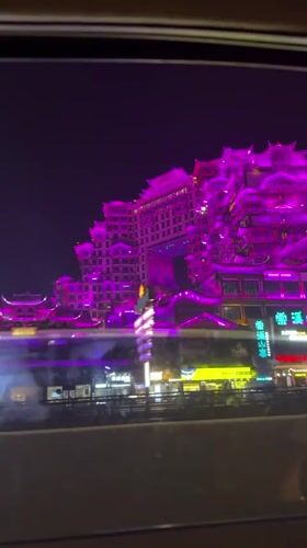 Night filming of illuminated traditional Chinese building in Zhangjiajie