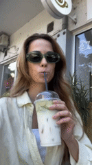 Woman enjoys matcha smoothie at Montenegro cafe