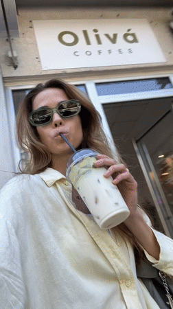 Woman enjoys matcha smoothie at Montenegro cafe