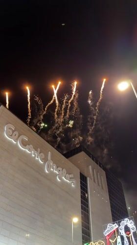 Fireworks light up the sky above El Corte Inglés