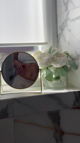 Bathroom mirror captures reflection in Chaykovsky home