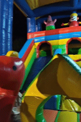 Children play on inflatable bounce house in Lhokseumawe