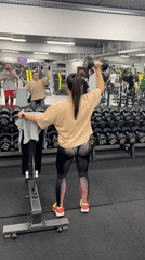 Woman exercises with dumbbells at Cheboksary gym