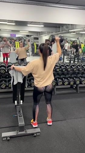 Woman exercises with dumbbells at Cheboksary gym